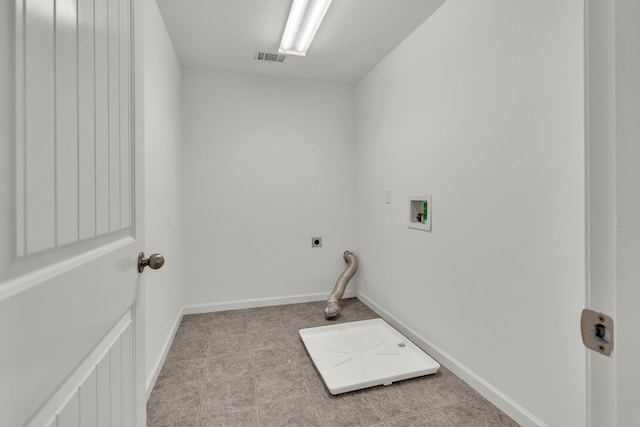 laundry area with washer hookup, hookup for an electric dryer, baseboards, and light tile patterned floors