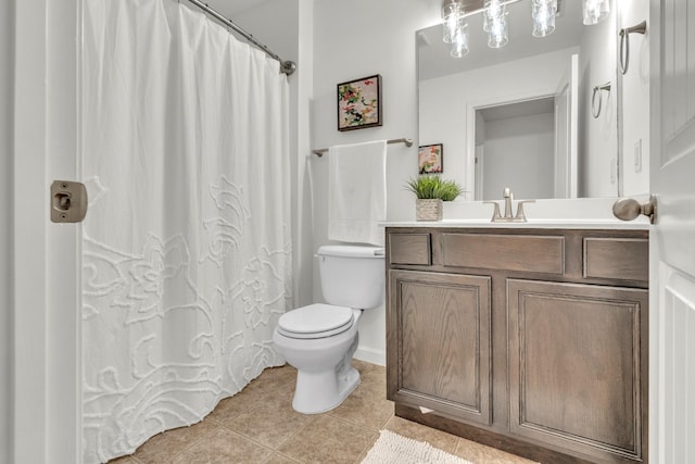 bathroom featuring tile patterned flooring, toilet, vanity, and curtained shower