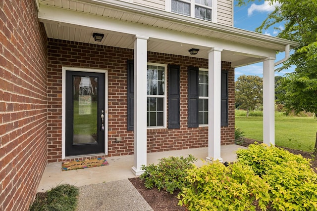 1000 Beverly Ln, Spring Hill, TN 37174 - entrance to property featuring covered porch, brick siding, and a yard