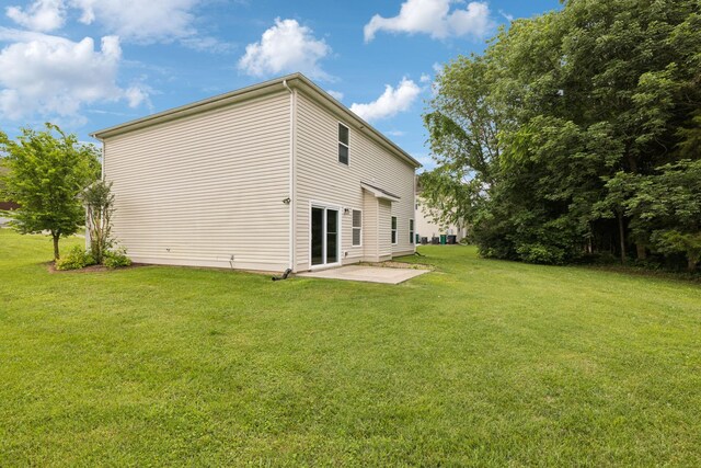 1000 Beverly Ln, Spring Hill, TN 37174 - back of property with a patio area and a yard