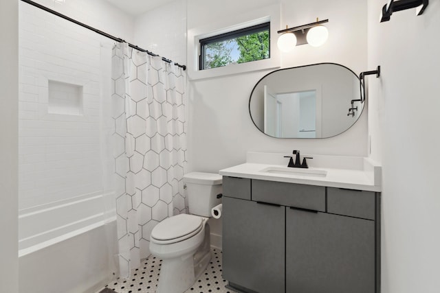 full bath with toilet, vanity, and shower / tub combo
