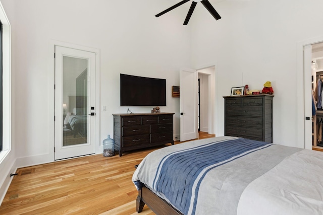 bedroom with light wood-style flooring and a ceiling fan