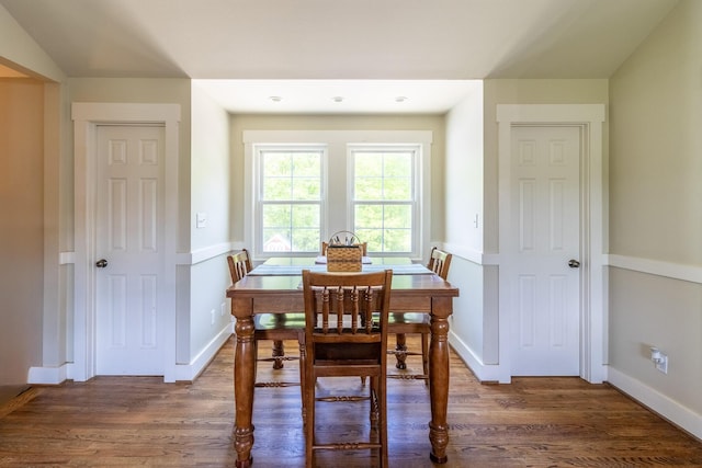 dining area with wood finished floors and baseboards