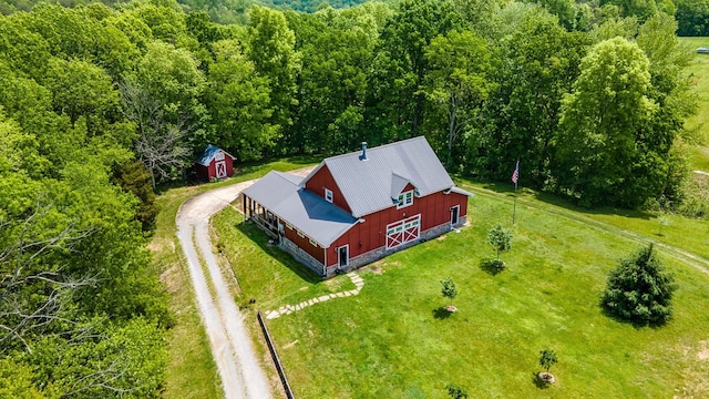 view from above of property featuring a heavily wooded area