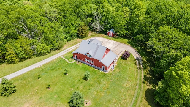 view from above of property featuring a heavily wooded area