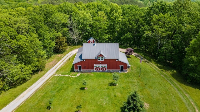 view from above of property with a heavily wooded area