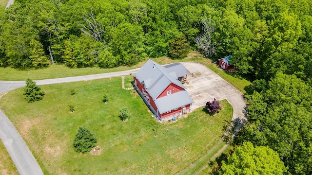 view from above of property with a forest