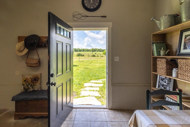 doorway featuring light tile patterned flooring