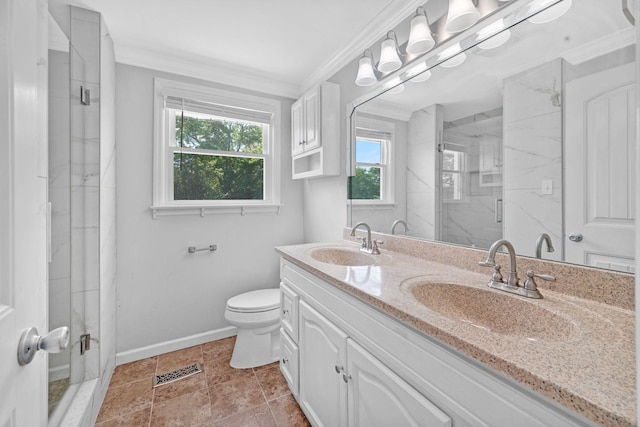 bathroom with a marble finish shower, baseboards, crown molding, toilet, and double vanity