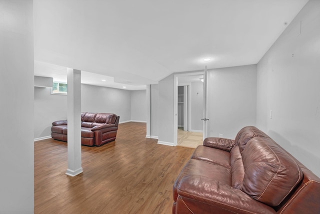 living room featuring wood finished floors, baseboards, and recessed lighting