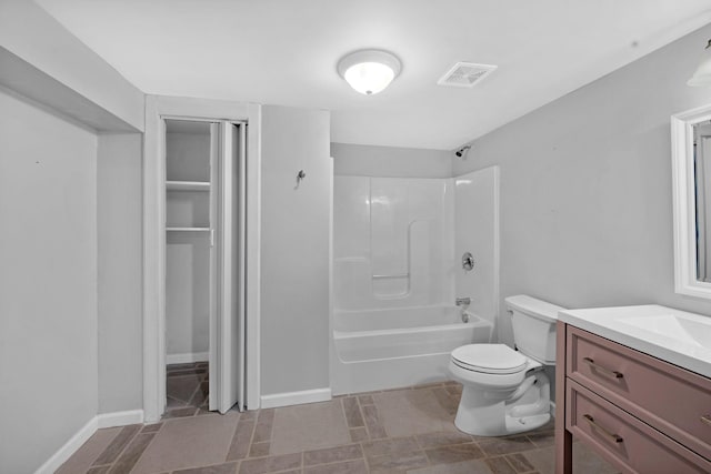 full bathroom featuring toilet, vanity, bathing tub / shower combination, and baseboards