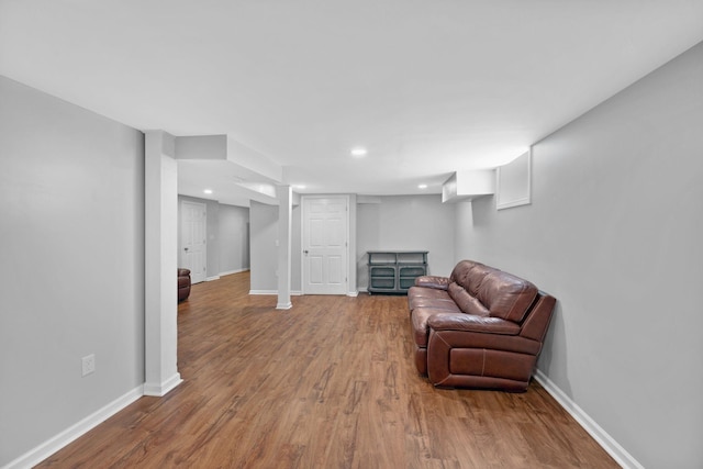 sitting room with wood finished floors, baseboards, and recessed lighting