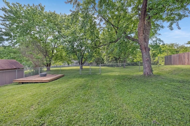 view of yard with a wooden deck