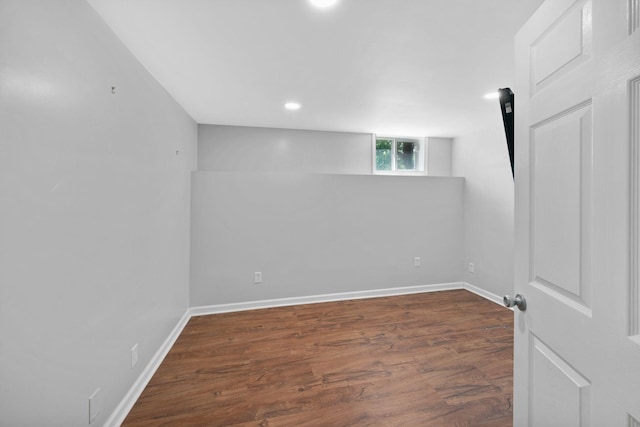 basement with wood finished floors, baseboards, and recessed lighting