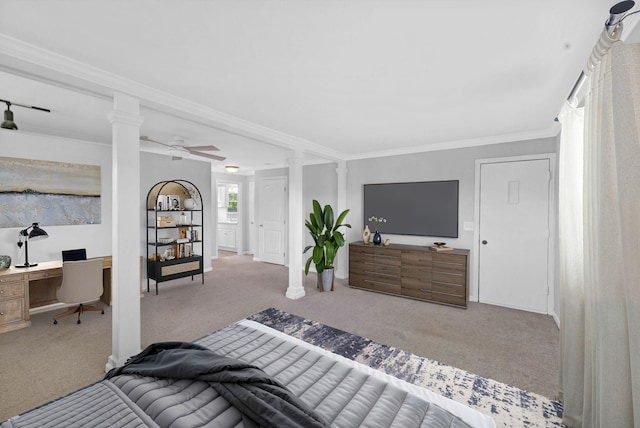 carpeted bedroom featuring a desk, decorative columns, and ornamental molding