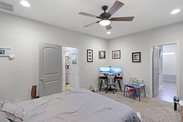 bedroom featuring recessed lighting, light colored carpet, baseboards, a ceiling fan, and connected bathroom