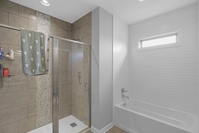 full bath with a shower stall, a tub, recessed lighting, tile patterned floors, and baseboards