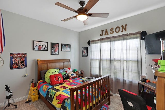 carpeted bedroom with baseboards and a ceiling fan