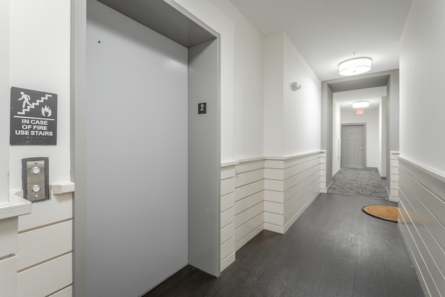 782 Riverfront Pkwy Unit 216, Chattanooga, TN 37402 - corridor with dark wood-style floors, a wainscoted wall, and elevator
