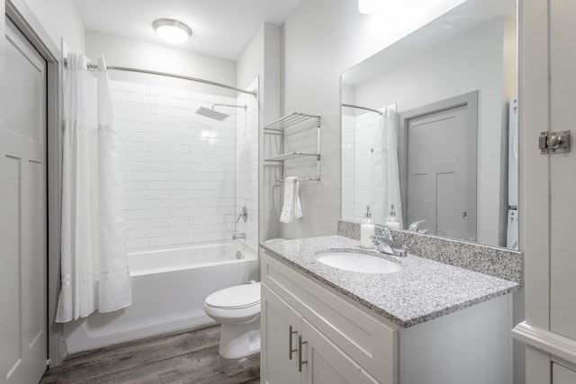 782 Riverfront Pkwy Unit 216, Chattanooga, TN 37402 - full bathroom with wood finished floors, shower / bath combination with curtain, vanity, and toilet