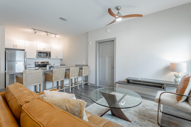 782 Riverfront Pkwy Unit 216, Chattanooga, TN 37402 - living area with wood finished floors and a ceiling fan