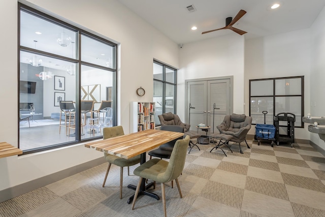 782 Riverfront Pkwy Unit 216, Chattanooga, TN 37402 - dining room featuring a high ceiling, ceiling fan, recessed lighting, baseboards, and a chandelier
