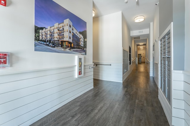 782 Riverfront Pkwy Unit 216, Chattanooga, TN 37402 - hallway featuring wood finished floors, wainscoting, and mail area