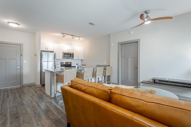 782 Riverfront Pkwy Unit 216, Chattanooga, TN 37402 - living area with dark wood-style floors and ceiling fan
