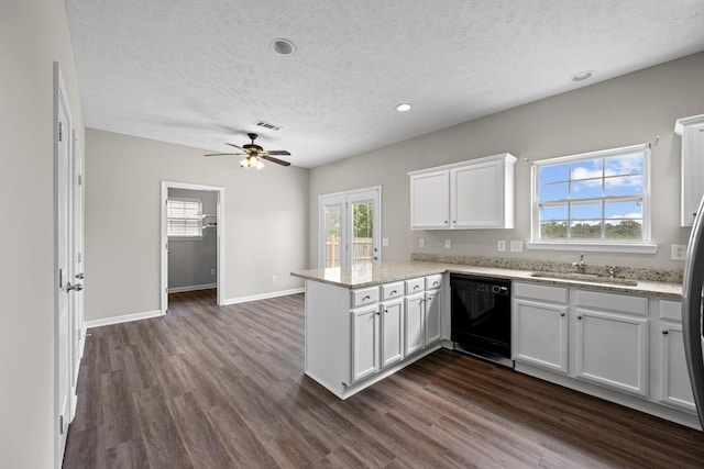 5029 Luker Ln, Antioch, TN 37013 - kitchen featuring black dishwasher, a sink, a peninsula, a textured ceiling, and dark wood-style flooring