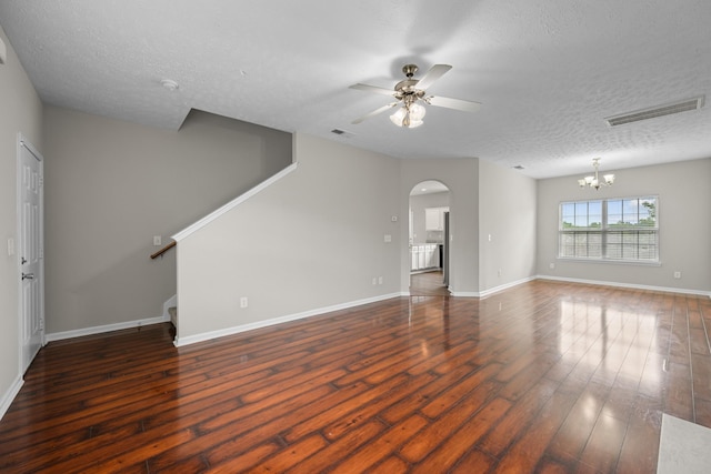 5029 Luker Ln, Antioch, TN 37013 - unfurnished living room with a ceiling fan, a textured ceiling, wood finished floors, stairs, and a chandelier