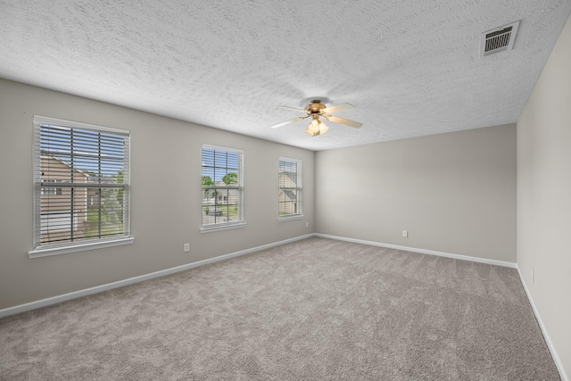 5029 Luker Ln, Antioch, TN 37013 - spare room with ceiling fan, carpet, baseboards, and a textured ceiling