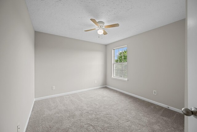 5029 Luker Ln, Antioch, TN 37013 - carpeted spare room with a ceiling fan, baseboards, and a textured ceiling
