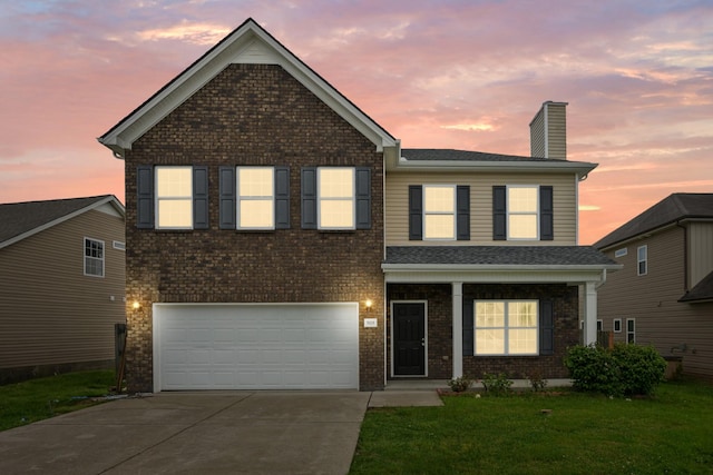5029 Luker Ln, Antioch, TN 37013 - traditional-style home with a chimney, concrete driveway, an attached garage, a front yard, and brick siding