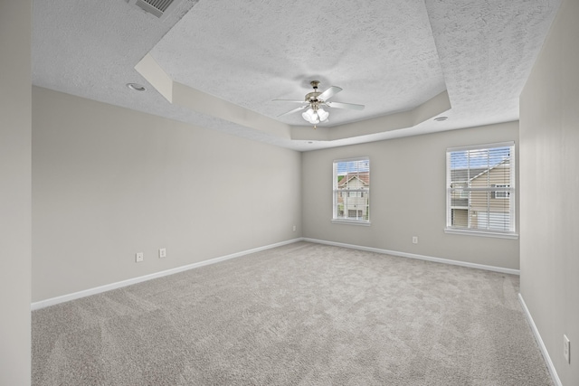 5029 Luker Ln, Antioch, TN 37013 - carpeted spare room featuring a textured ceiling, a raised ceiling, a ceiling fan, and baseboards