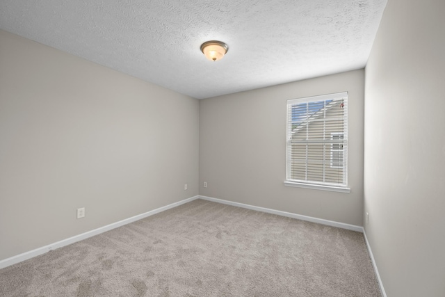 5029 Luker Ln, Antioch, TN 37013 - empty room featuring baseboards, carpet floors, and a textured ceiling