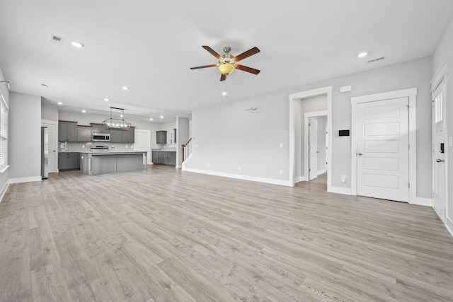 1132 General Marshall Ct, Murfreesboro, TN 37129 - unfurnished living room featuring recessed lighting, ceiling fan, baseboards, light wood-type flooring, and stairway
