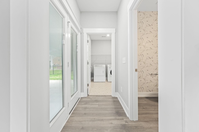 1132 General Marshall Ct, Murfreesboro, TN 37129 - hallway with washing machine and dryer, light wood finished floors, wallpapered walls, and baseboards