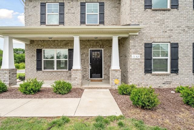 1132 General Marshall Ct, Murfreesboro, TN 37129 - doorway to property with brick siding and covered porch