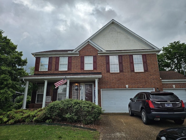 view of front facade featuring brick siding, concrete driveway, and a garage