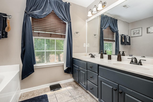 101 Wolverine Trl, La Vergne, TN 37086 - bathroom featuring baseboards, tile patterned flooring, double vanity, and a bathtub