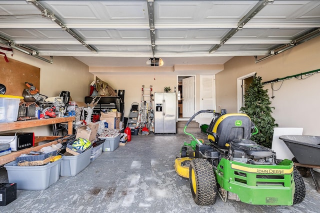 101 Wolverine Trl, La Vergne, TN 37086 - garage featuring stainless steel refrigerator with ice dispenser and a garage door opener
