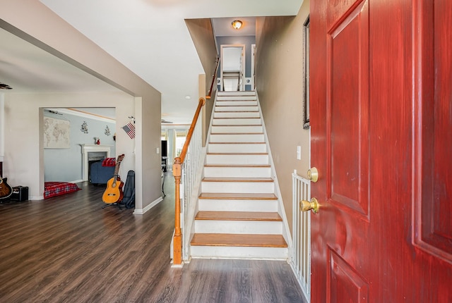 101 Wolverine Trl, La Vergne, TN 37086 - stairway with a fireplace, wood finished floors, and baseboards