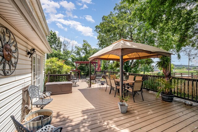 101 Wolverine Trl, La Vergne, TN 37086 - wooden deck with outdoor dining space, a gazebo, and a hot tub