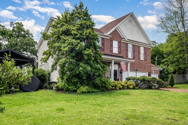 101 Wolverine Trl, La Vergne, TN 37086 - view of front of house with brick siding and a garage