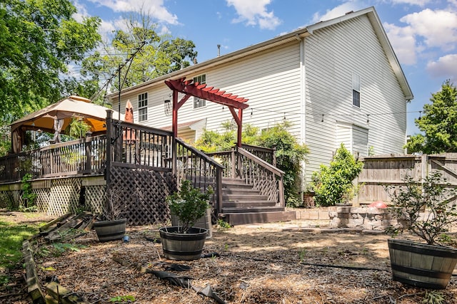 101 Wolverine Trl, La Vergne, TN 37086 - back of property featuring a wooden deck, a gazebo, stairway, and fence