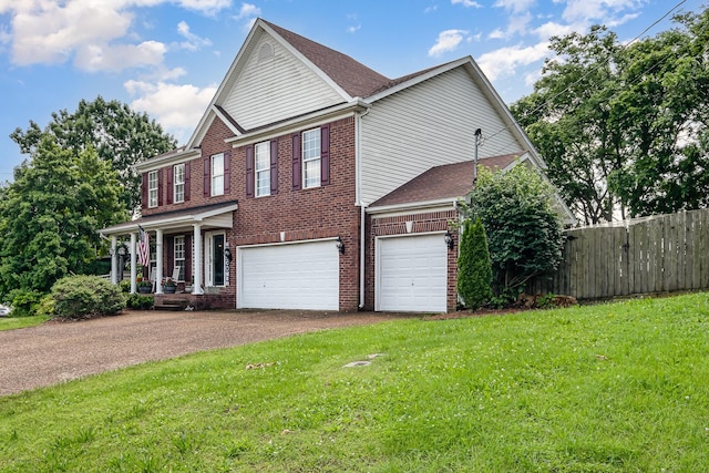 101 Wolverine Trl, La Vergne, TN 37086 - view of front facade with driveway, covered porch, a garage, and brick siding