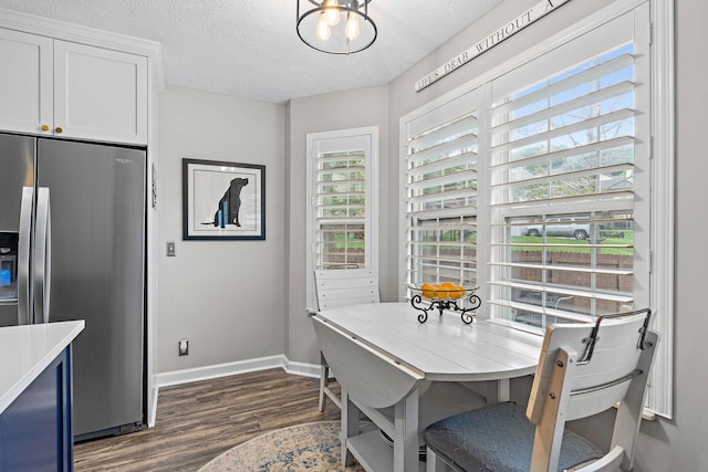 102 Braxton Park Ct, Goodlettsville, TN 37072 - dining space featuring dark wood-style flooring, baseboards, and a textured ceiling