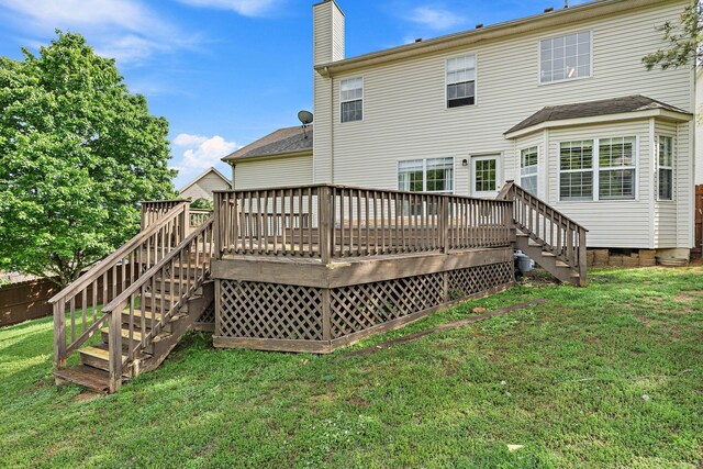 102 Braxton Park Ct, Goodlettsville, TN 37072 - back of house featuring stairs, a lawn, a wooden deck, and a chimney