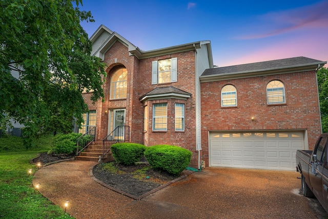 102 Braxton Park Ct, Goodlettsville, TN 37072 - traditional-style home featuring a garage, brick siding, and driveway