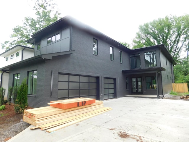 4026B Lealand Ln, Nashville, TN 37204 - rear view of property with an attached garage, french doors, brick siding, and driveway